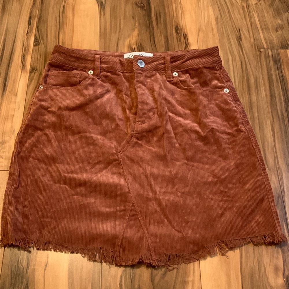 Small, mini, rust skirt with frayed bottom